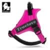 The Truelove Dog Handle Harness | Lightweight, Reflective & Strong is shown in grass fushia on a white background. It features reflective stitching, a sturdy handle, and the Truelove logo with a dog's head in the top left corner.