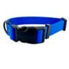 The Wave Waterproof Dog Collar with a quick release buckle, available in 16mm, 20mm, and 25mm sizes, features a blue hexagon pattern and metal D-ring for lead attachment, displayed on a white background.
