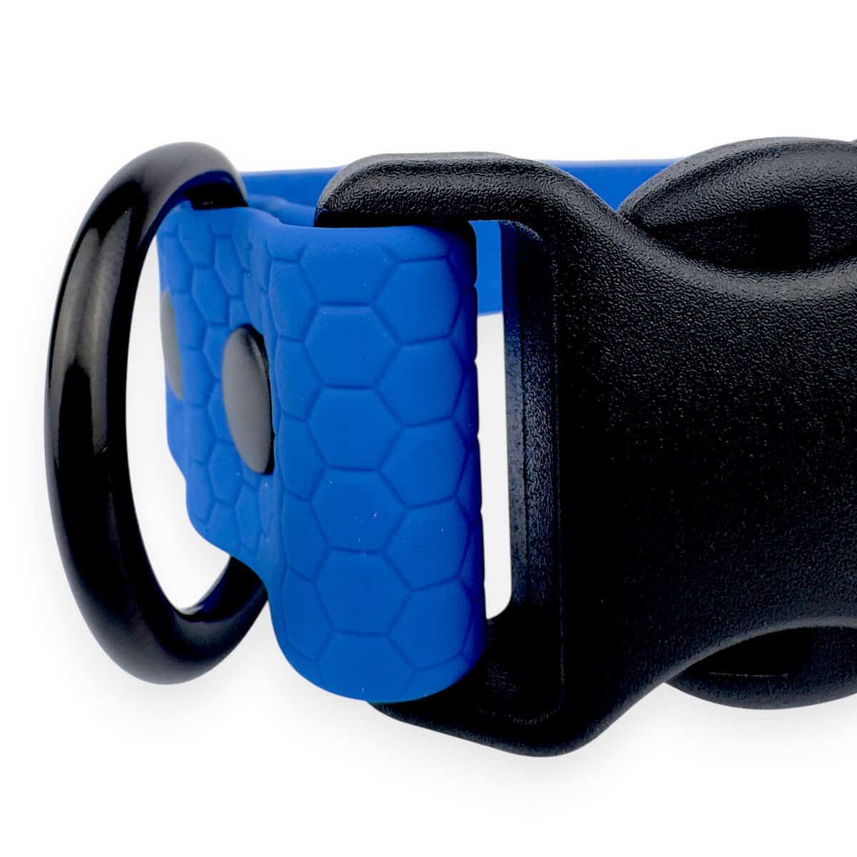 Close-up of the Wave Waterproof Dog Collar with a blue hexagonal pattern, quick release buckle, large black metal ring, and available in 16mm, 20mm, or 25mm widths.