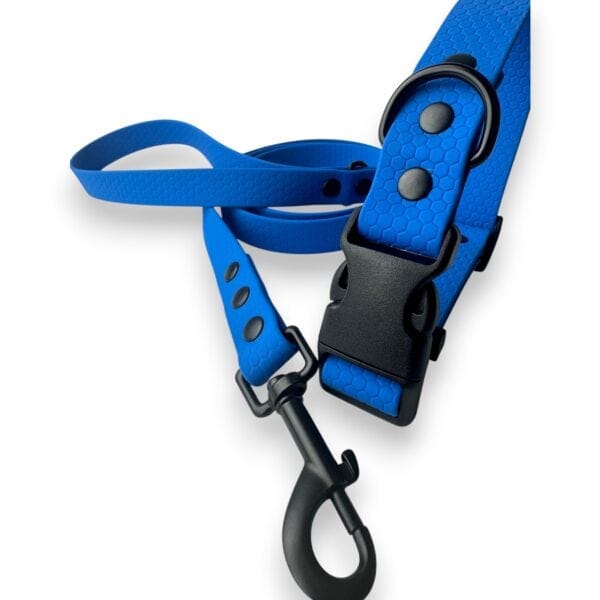 The Wave Waterproof Dog Collar with Quick Release Buckle, available in 16mm, 20mm, and 25mm sizes, is shown in blue with a textured finish and metal lead clip on a white background.