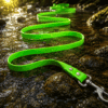 A WAVE – Long line, in bright green and designed to be waterproof, lies in a zigzag pattern across wet rocks in a shallow stream, with sunlight shining in the background.