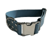A PETROL BLUE colored Wide Waterproof Buckle Collar - Metal edition, Biothane™, W 38 mm with a silver clasp and metal eyelets. The distinctive metal edition features double loops for additional fastening support. The image showcases the strap slightly coiled to display both the buckle and loops.