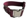 A RED WINE -colored Wide Waterproof Buckle Collar - Metal edition, Biothane™, W 38 mm with a silver clasp and metal eyelets. The distinctive metal edition features double loops for additional fastening support. The image showcases the strap slightly coiled to display both the buckle and loops.