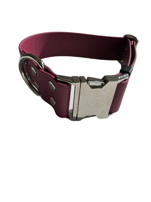 A RED WINE -colored Wide Waterproof Buckle Collar - Metal edition, Biothane™, W 38 mm with a silver clasp and metal eyelets. The distinctive metal edition features double loops for additional fastening support. The image showcases the strap slightly coiled to display both the buckle and loops.
