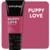 A black Animology Puppy Love Shampoo 250ml tube against a pink background, with a pink and black label emphasizing deep cleaning and built-in conditioner. White text beside it reads "PUPPY LOVE.