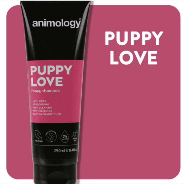 A black Animology Puppy Love Shampoo 250ml tube against a pink background, with a pink and black label emphasizing deep cleaning and built-in conditioner. White text beside it reads "PUPPY LOVE.