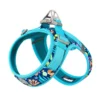 A turquoise Truelove Cooling Dog Harness - Dual D-Rings & Hook-and-Loop TLH30131, with floral and animal patterns, adjustable straps, a metal leash ring, and cushioned mesh lining for comfort.