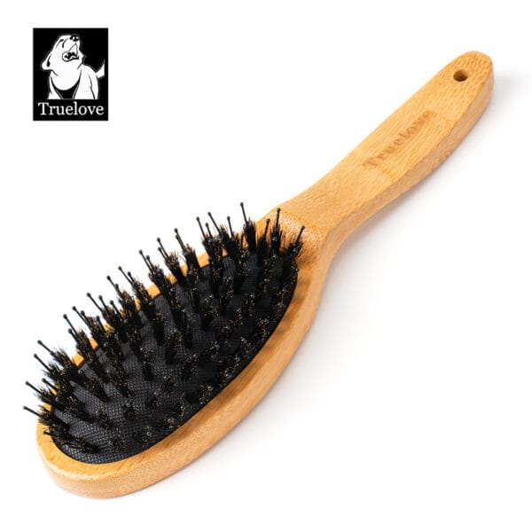The Truelove Bamboo Pet Brush – Dual-Action Grooming Comb for Dogs & Cats, featuring a wooden handle and black bristles, is displayed on a white background with the Truelove dog logo in the upper left corner.