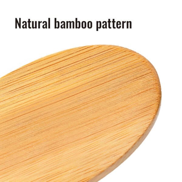 Close-up of the Truelove Bamboo Pet Brush’s oval-shaped surface, showcasing its natural bamboo grain; text above reads "Natural bamboo pattern.