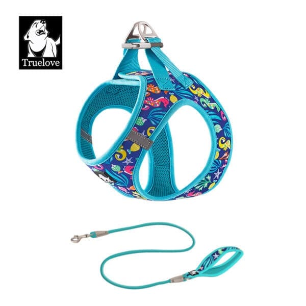 The Truelove Easy Fit Quick-Release Pet Harness with Dual D-Rings features a vibrant ocean-themed pattern, padded design, sturdy metal rings, and is paired with a matching turquoise leash. The Truelove dog head logo appears in the corner.