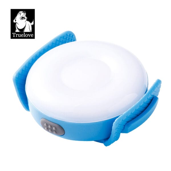 The Truelove TLD19103 Pet LED Light is a round, blue and white waterproof rechargeable safety light with textured blue side clips and the Truelove dog logo in the upper left corner.