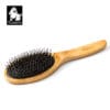 The Truelove Bamboo Pet Brush – Dual-Action Grooming Comb for Dogs & Cats, featuring a wooden handle and metal bristles on a black cushion, appears on a white background with the Truelove dog logo in the top left corner.
