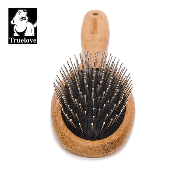 The Truelove Bamboo Pet Grooming Comb – Premium Brush features a wooden handle, metal bristles with rounded tips, and is shown on a white background. The "Truelove" logo with a dog's head appears in the top left corner.