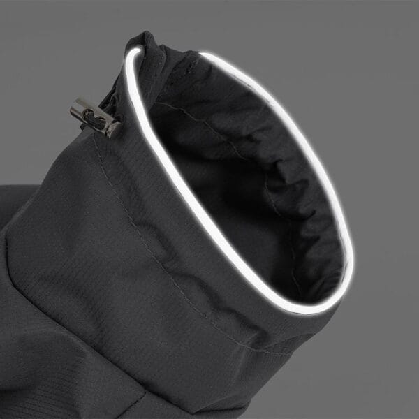 Close-up of the reflective collar on the gray dog raincoat, highlighting the visibility and safety features in dark or rainy conditions.