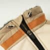 Close-up of the zipper detail on the Luxury Winter Dog Coat in orange, showcasing the sleek design with a smooth zipper for easy wear.