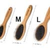 Three wooden hairbrushes of different sizes—small (19.5 cm), medium (22 cm), and large (23 cm)—are displayed side by side, each labeled with "S," "M," or "L" above them.