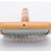 A close-up of the Truelove Bamboo Pet Comb - Grooming Tool, featuring a rectangular wooden head with fine metal bristles, displayed against a white background.