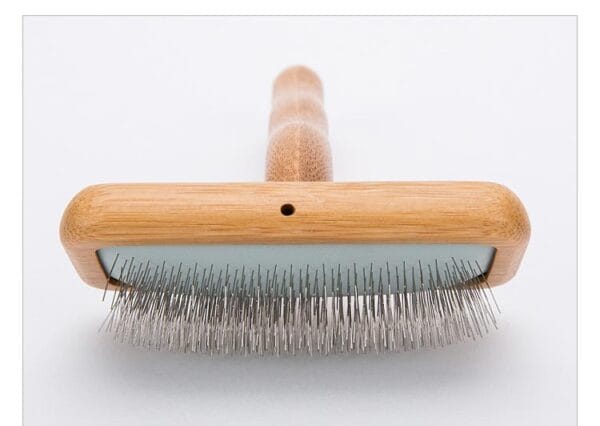 A close-up of the Truelove Bamboo Pet Comb - Grooming Tool, featuring a rectangular wooden head with fine metal bristles, displayed against a white background.