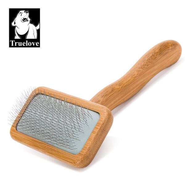 The Truelove Bamboo Pet Comb - Grooming Tool features fine metal bristles and a bamboo handle, displayed on a white background with the Truelove logo showing a dog's head in the top left corner.