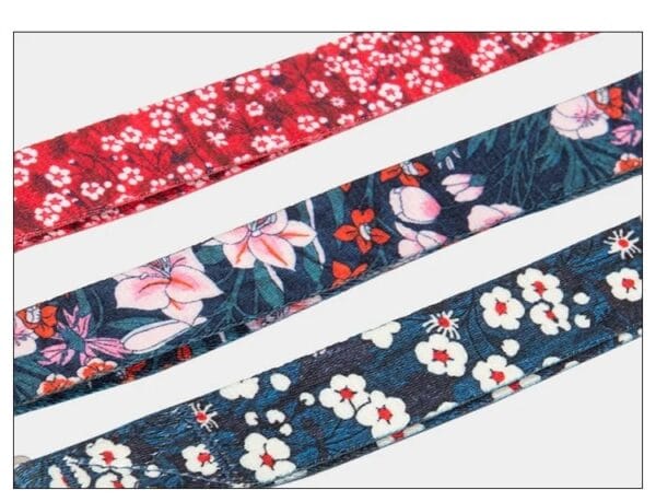 The Truelove Functional Dog Leash with Neoprene Handle TLL3112 features three stylish fabric ribbons: red with white flowers, dark blue with pink lilies and red accents, and navy with white and red cherry blossom designs.
