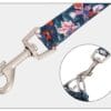 A close-up of the Truelove Functional Dog Leash with Neoprene Handle TLL3112 shows a metal swivel snap hook on a floral-patterned strap, with an inset displaying the hook connected to metal rings.