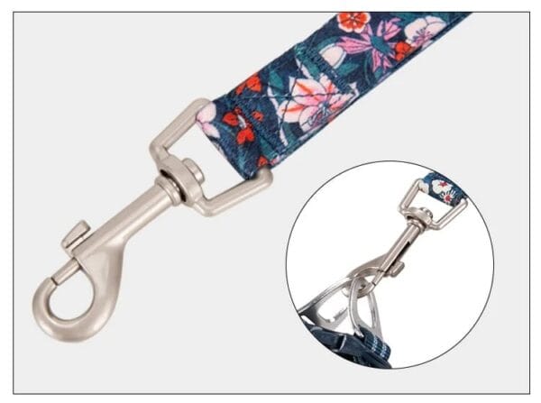 A close-up of the Truelove Functional Dog Leash with Neoprene Handle TLL3112 shows a metal swivel snap hook on a floral-patterned strap, with an inset displaying the hook connected to metal rings.