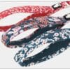 Three Truelove Functional Dog Leash with Neoprene Handle TLL3112 leashes are shown: red with white flowers, navy with red and white flowers, and teal with white and red flowers.
