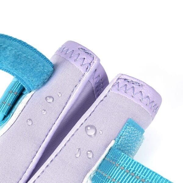 Close-up of two lavender and light blue padded fabric straps with visible stitching on Truelove Waterproof Outdoor Pet Shoes - Reflective Strap TLS3963, featuring blue hook-and-loop fasteners, water droplets, and water-resistant material.