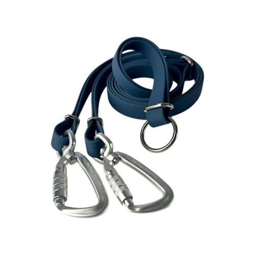 A WAVE Hands-Free Lead PRO, blue, with two metal carabiner clips and a large metal ring, is coiled neatly on a white background.