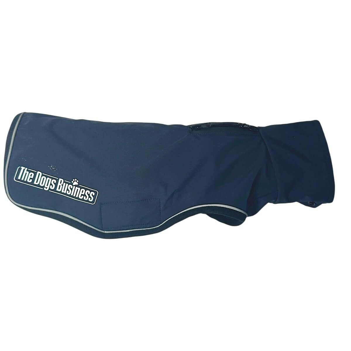 The TDB light Jacket is a dark blue, waterproof, fleece-lined dog jacket with "The Dogs Business" logo on the side, reflective trim, and a back zip.