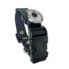 The Dogs Business Safety Light features a black adjustable strap, a round clear-lensed LED light, and a large plastic buckle—ideal for attaching to kit or clothing. Shown on a white background.