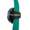A close-up of The Dogs Business Safety Light, a black circular device with a teal band labelled “The Dogs Business” in white text, shown against a plain white background.
