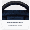 Close-up of a black padded grab handle on a bag, with text below reading “PADDED GRAB HANDLE. For secure close control.”.