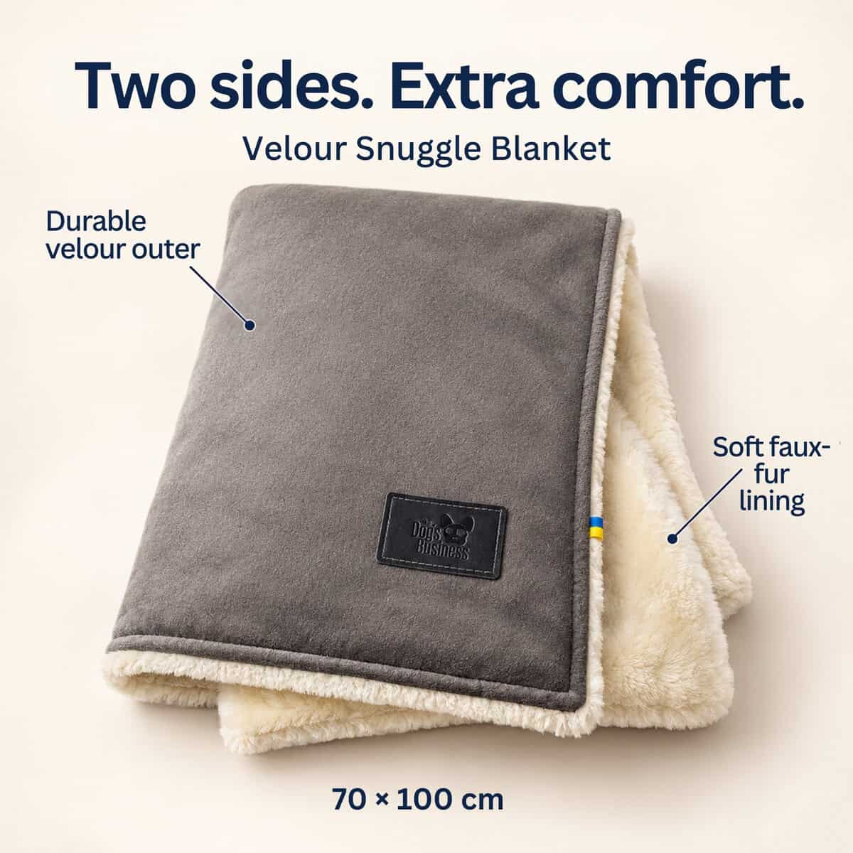 Folded grey Velour Snuggle Blanket with a cream-coloured faux-fur lining, featuring a durable outer layer and soft interior.