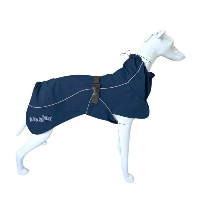 A navy blue Coastal Jacket Light dog raincoat with reflective piping and a buckled waist strap on a white mannequin dog.