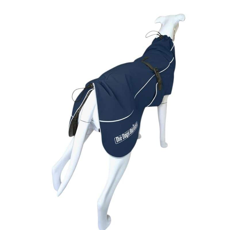 A white mannequin dog wearing a navy Coastal Jacket Light with white piping and a logo on the back.